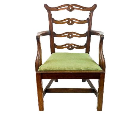 A 19th century Chippendale style child's ladder back armchair. with drop in seat.