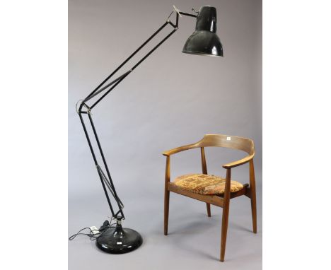 A large black finish anglepoise-type desk lamp.