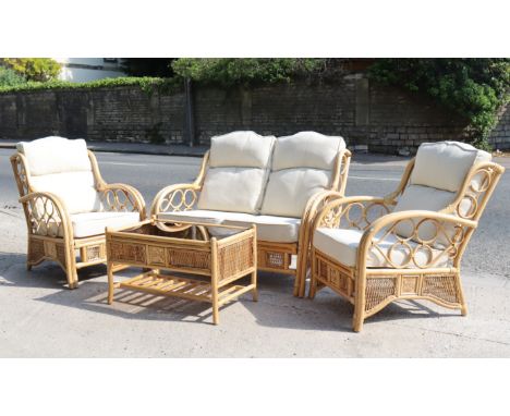 A rattan four-piece conservatory suite comprising of a two-seater settee with loose cushions to the seat &amp; back, 49” wide