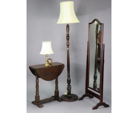 A mahogany rectangular cheval mirror inset with a bevelled plate, 56” high; together with an oak circular drop-leaf occasiona