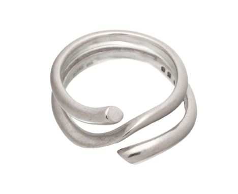 An 18ct white gold 'Magic' ring, by Georg Jensen,of coiled court section form, with a knife edge centre, no.1314, followed by