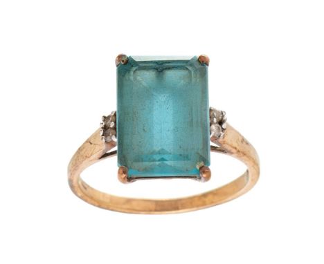 A vintage 9ct gold, topaz and diamond set dress ring, the emerald stone of approximately 14.1 by 10.1mm, with a pair of small
