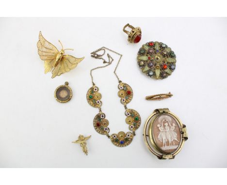 An enamel and paste necklace, set with five pierced decorative, paste set panels, with enamel flower and leaf detail, togethe