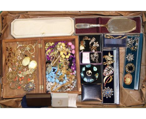 A collection of costume jewellery to include vintage brooches, necklaces, gold plated items, watches, vintage jewellery boxes