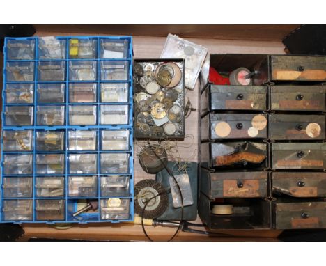 A collection of pocket watch and wristwatch parts to include dials, movements, cases, springs and similar items in a vintage 