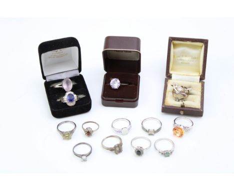 A  group of ten silver dress rings, mostly set with gem stones, including opal, quartz, topaz and others, total weight 20.7g 