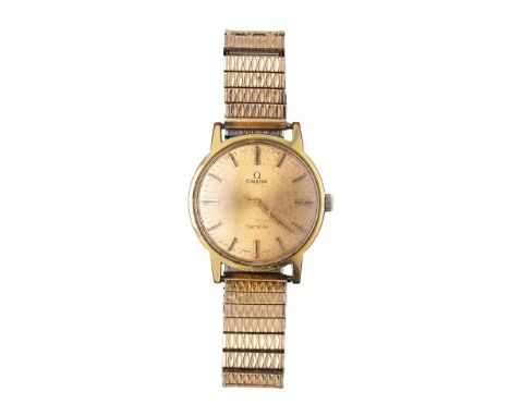 A gentleman's vintage Omega wristwatch, the signed gold coloured dial with baton markers and minute track, with gold plated b