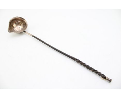 A silver toddy ladle, likely 18th century though marks very rubbed, the bowl inset with a Queen Anne silver fourpence, with b