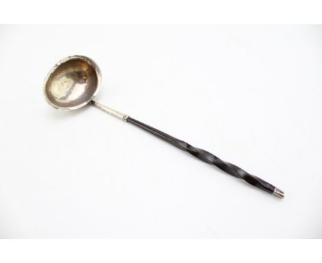 A George III silver toddy ladle, of small size with simple oval bowl, and baleen twist handle, makers marks rubbed, likely El