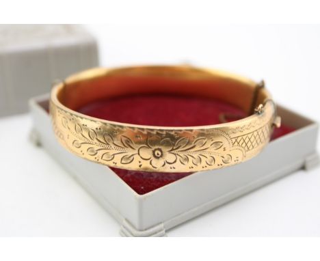 An antique 9ct gold with metal core bangle in a vintage H. Samuel jewellery box.