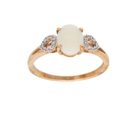 A 10ct gold opal and diamond dress ring, set with oval opal of approximately 8.9 by 7.3mm, the heart shaped shoulders studded