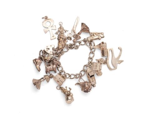 A silver curb link charm bracelet with heart shaped padlock clasp, and eleven charms including Scottie dog, Coronation coach,