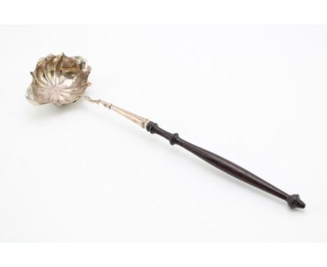 A George III silver toddy ladle with double pouring bowl, of shell form, hallmarked to the bowl, maker's mark rubbed, London 