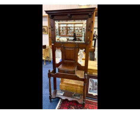 Late Victorian Mahogany Hall Stand, traditional style, mirror back and coat hooks, central drawer with lead umbrella wells.  