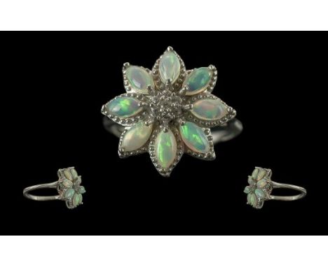 Attractive Quality Opal Floral Ring, the flower comprising eight marquise cut opal cabochons, with generous splashes of colou