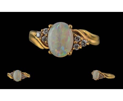 Ladies 9ct Gold Opal and Diamond Set Ring, Marked 9ct to Interior of Shank. The Central Opal of Pleasing Colours, Est 1.00 ct