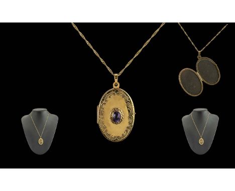 Ladies - Pleasing 9ct Gold Amethyst Set Hinged Locket of Oval Form, Attached to a 9ct Gold Fancy Chain. Locket / Chain Marked