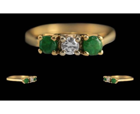 Ladies 18ct Gold Pleasing 3 Stone Emerald &amp; Diamond Set Dress Ring - Not Marked but Tests 18ct. The central Diamond Flank