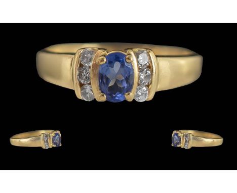 Ladies 14ct Gold Contemporary Diamond and Sapphire Set Ring - Marked 14ct To Interior Of Shank. The Blue Sapphire Of Good Col