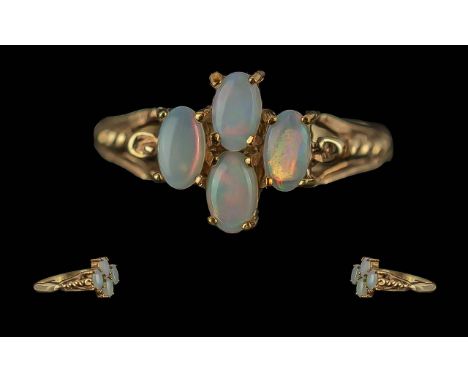 Ladies Attractive 9ct Gold Opal Set Ring. Marked 9.375 to Shank. Pleasing Design. The Four Well Matched Opals of Good Colour.