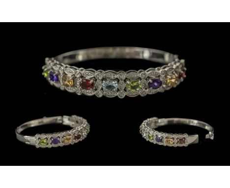 Peridot, Amethyst, Red Garnet, Blue Topaz and Citrine Set Bangle - octagon cuts of each gemstone, all of a generous size, set
