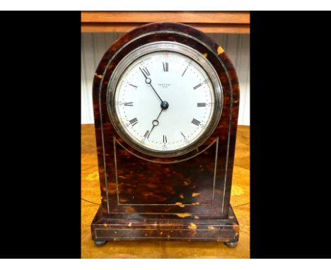 Tortoiseshell Mantle Clock, domed top with silver inlay, white porcelain dial with Roman numerals, marked Sampson, York, spri