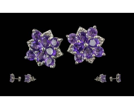 Amethyst Cluster Stud Earrings, the clusters comprising rich deep purple amethysts, of good quality, set in platinum vermeil 