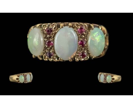 Ladies Pleasing 9ct Gold Opal and Garnet Set Ring, The Well Matched Large Opals of Good Colour with Garnet Spacers. Ring Size