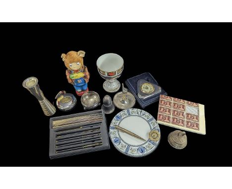 Box of Collectibles, comprising a set of ballpoint pens, a ring holder, a vintage wind up toy of a bear eating corn, a candle