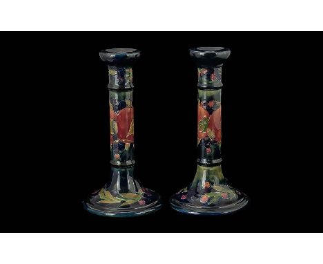 William Moorcroft Signed Pair of Candlesticks Hand Painted In the Pomegranate / Berries Design. c.1915 - 1930. Signed William
