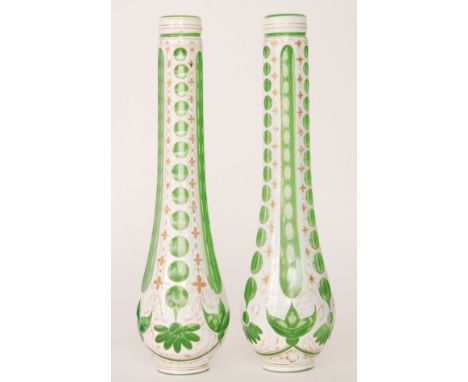 A pair of 19th Century Bohemian sleeves cased in opal over green and flash cut in a repeat panel design and gilded floral det