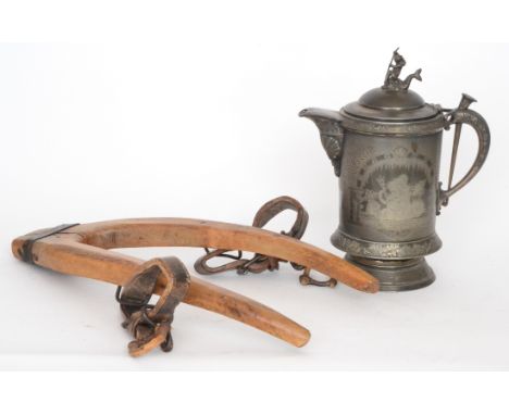 A 19th Century shaped elm and iron strap bound dog halter with leather straps together with a large pewter hot water tankard 