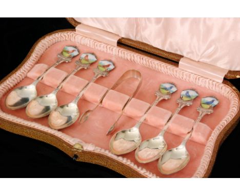 A set of six hallmarked silver and enamel presentation spoons, each terminating in a shield shaped enamelled plaque depicting