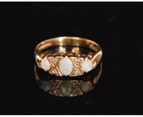 An Edwardian style 9ct hallmarked opal and diamond seven stone boat shaped ring, ring size O.