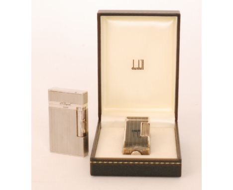A Dunhill Swiss made rollalight gas lighter with black enamel design in original box, A/F, together with a S J Dupont, Paris 