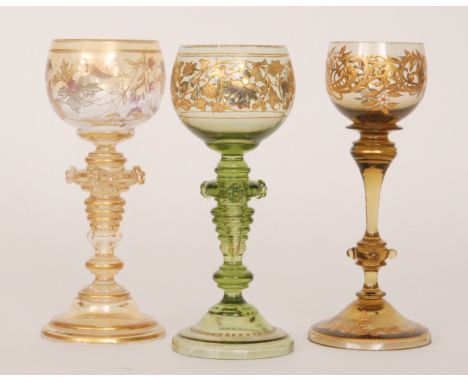 An early 20th Century wine glass by Fritz Heckert with ovoid bowl above a ringed inverted baluster form stem with applied pru