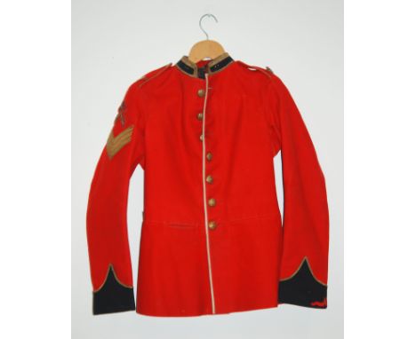 A Royal Warwickshire 1904 pattern red tunic together with two tin helmets and a Warwickshire Civil Defence helmet (4)