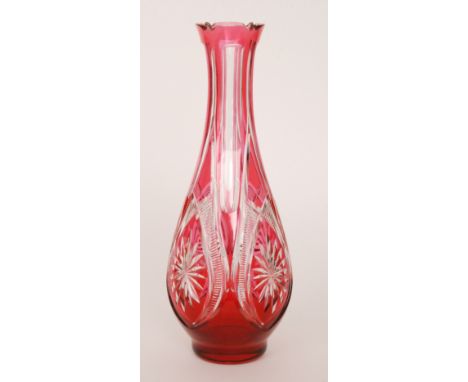 A large 20th Century French crystal glass vase by Cristal Nancy of tapered ovoid form with a petal edged rim, cased in ruby o