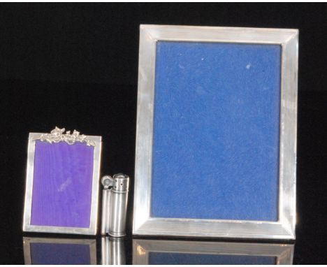 A Sterling silver rectangular easel photograph frame with reeded border, height 21cm x  width 16cm, Reed and Barton, together