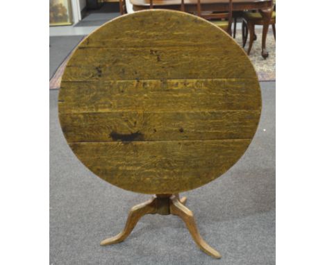 A George III oak circular tripod occasional table, diameter 91cm