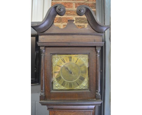 An 18th Century and later oak longcase clock with 30-hour movement, the hood with twin swan neck pediment enclosing a 10 inch