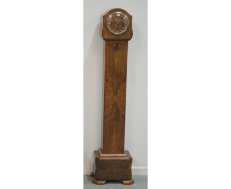 A late 1930s walnut cased Grandmother clock the long trunk door over a canted bombe base, height 145cm.