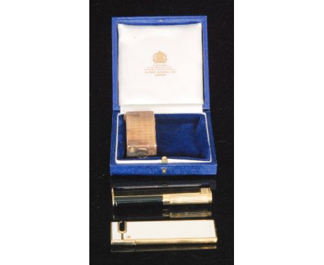 A 1970s French silver gilt Dunhill lighter of rectangular outline and engine turned design, French assay marks and London imp