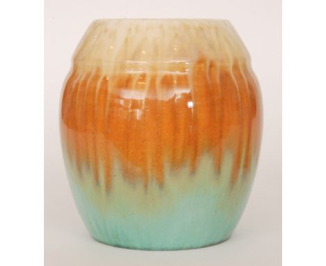 A Ruskin Pottery vase of swollen form decorated with a cream to orange to green dribble glaze, impressed mark and dated 1931,