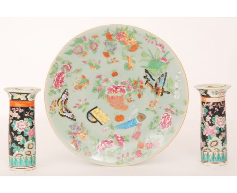 A late 19th to early 20th Century Chinese celadon plate decorated with enamel butterflies, radish, chrysanthemum and scholars