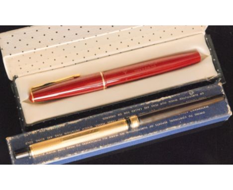 An early 20th Century dip pen with 18ct engine turned decorated sleeve, engraved with name to cartouche, together with a late