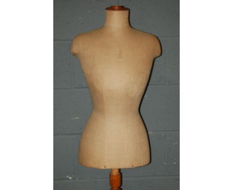 An Edwardian ladies mannequin on a turned wooden base together with a counter top display mannequin by Venus in blue cloth (2