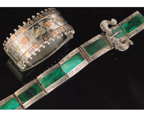 A Victorian silver and malachite strap bracelet formed of seven rectangular links each inset with a malachite panel beside fo