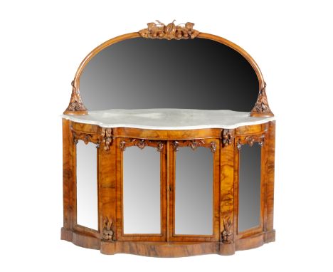 A Victorian walnut serpentine fronted chiffonier, the mirror upright panel with carved seed pod crest above the marble top an