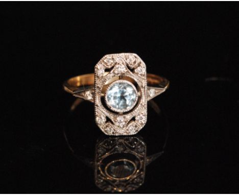 A 9ct hallmarked Edwardian style aquamarine and diamond cluster ring, rectangular pierced head with central circular collar s